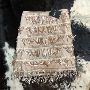 Neutral creme colored sequin layered fringe skirt